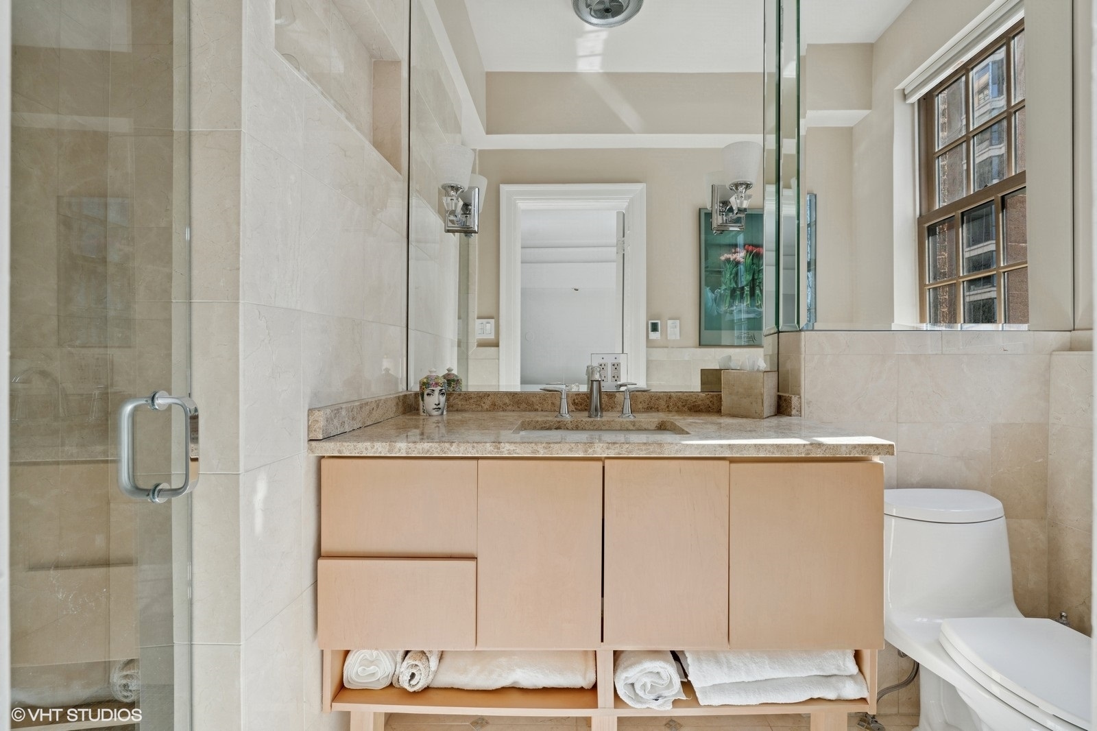232 East Walton Place, Unit 4E Chicago, IL 60611 - Photo 21 of 32 a bathroom with a granite countertop sink a toilet and a mirror