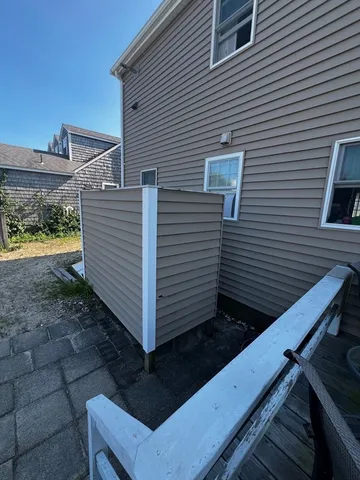 a view of a balcony with furniture and a table