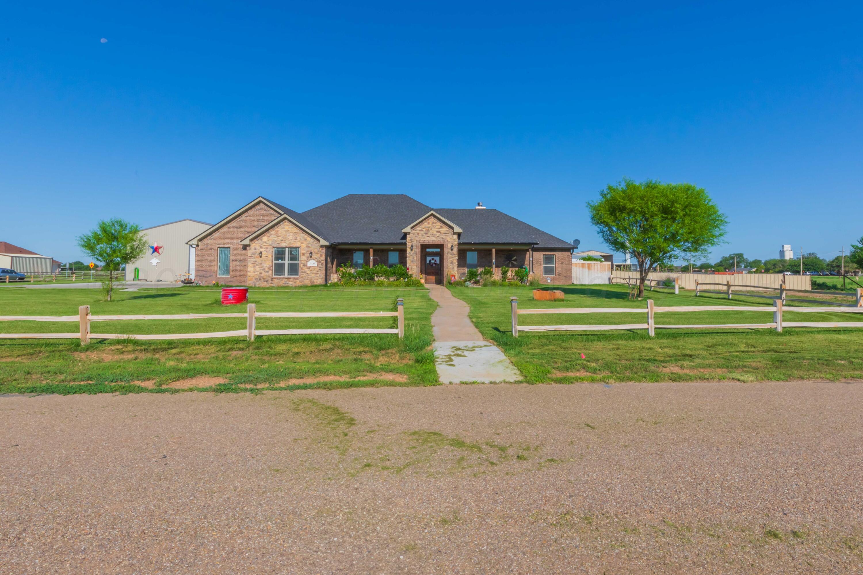 2450 Blue Springs Amarillo, TX 79124 - Photo 2 of 51 a view of a house with a big yard and potted plants