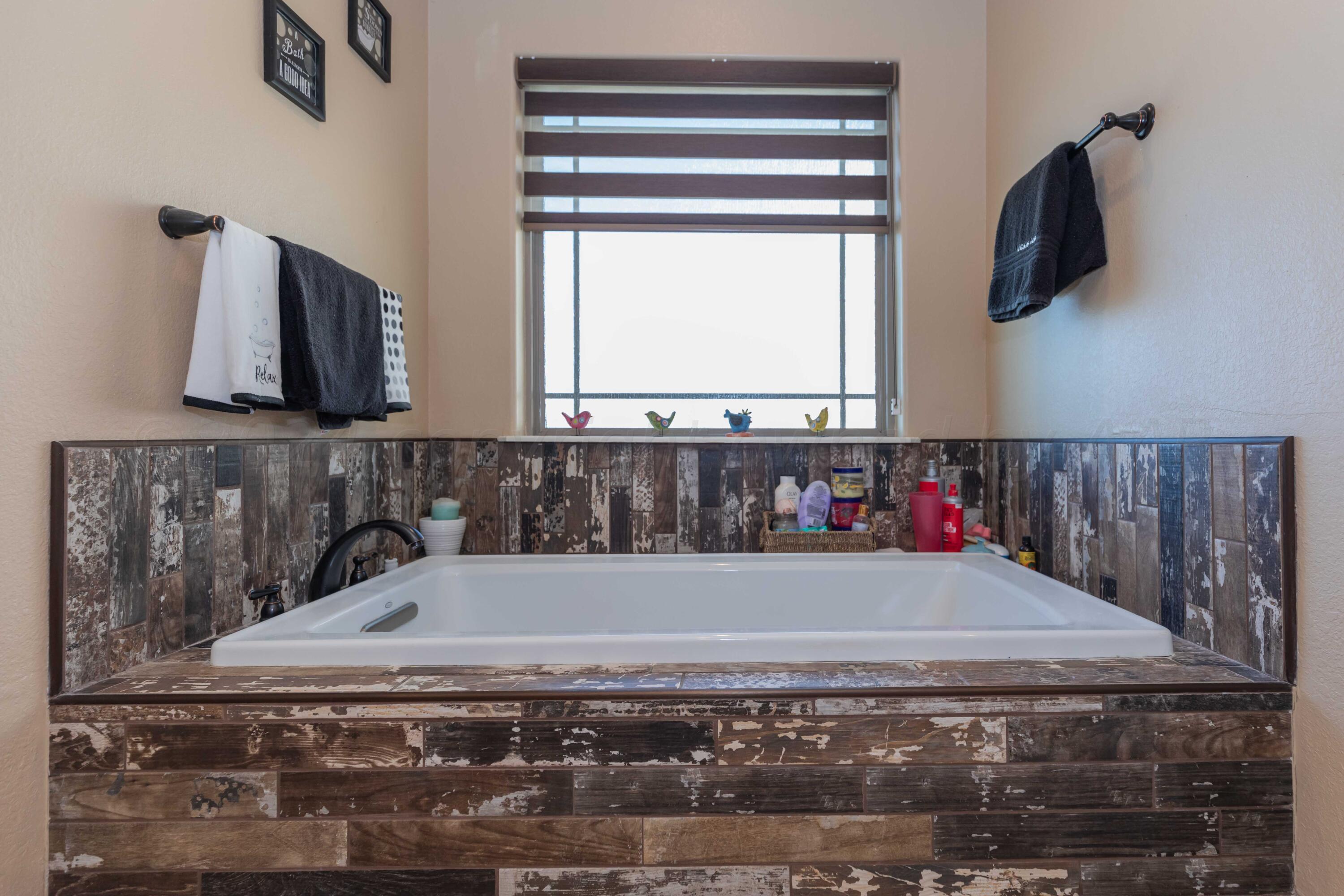 2450 Blue Springs Amarillo, TX 79124 - Photo 22 of 51 a bathroom with a bathtub