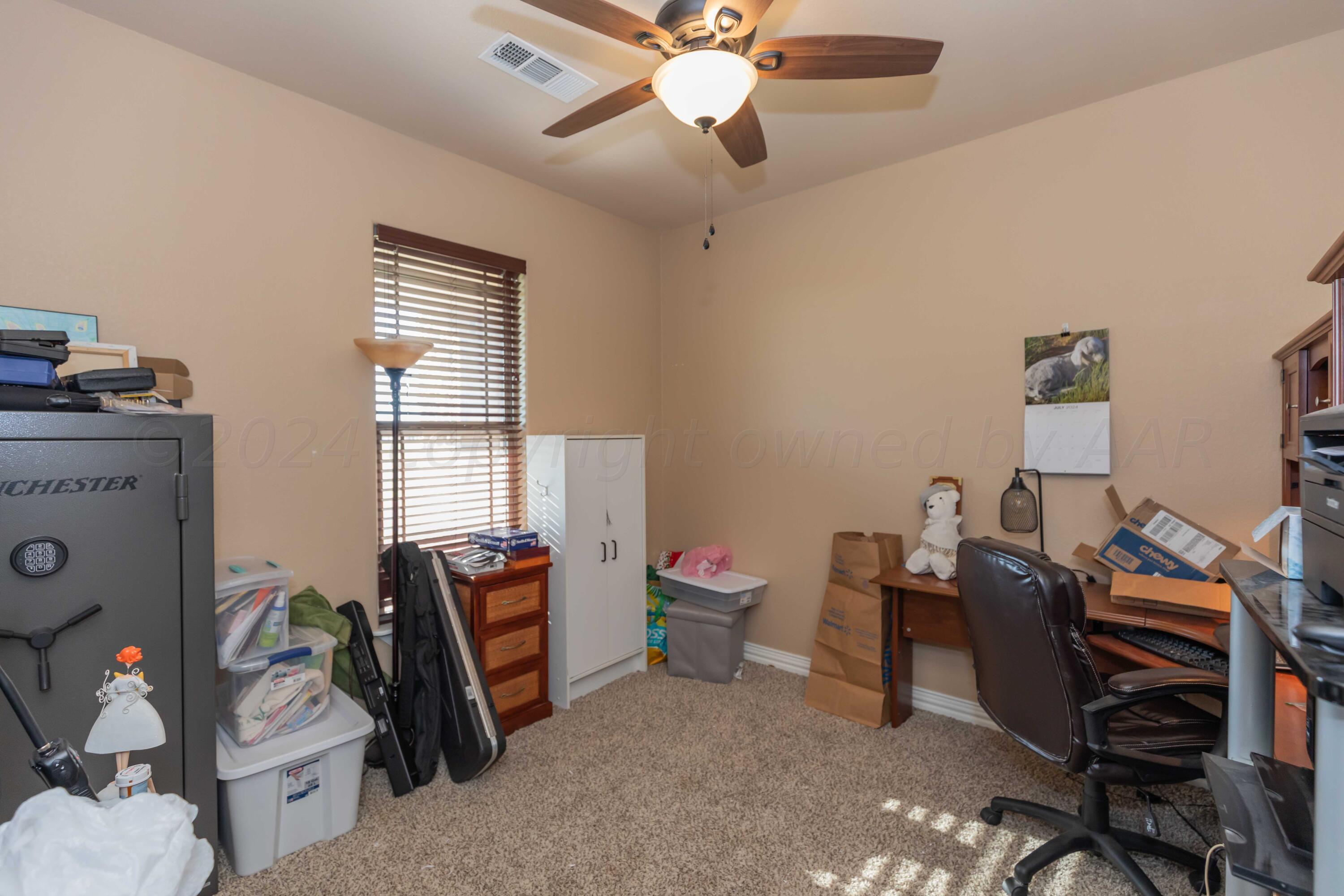 2450 Blue Springs Amarillo, TX 79124 - Photo 27 of 51 a bedroom with a workspace