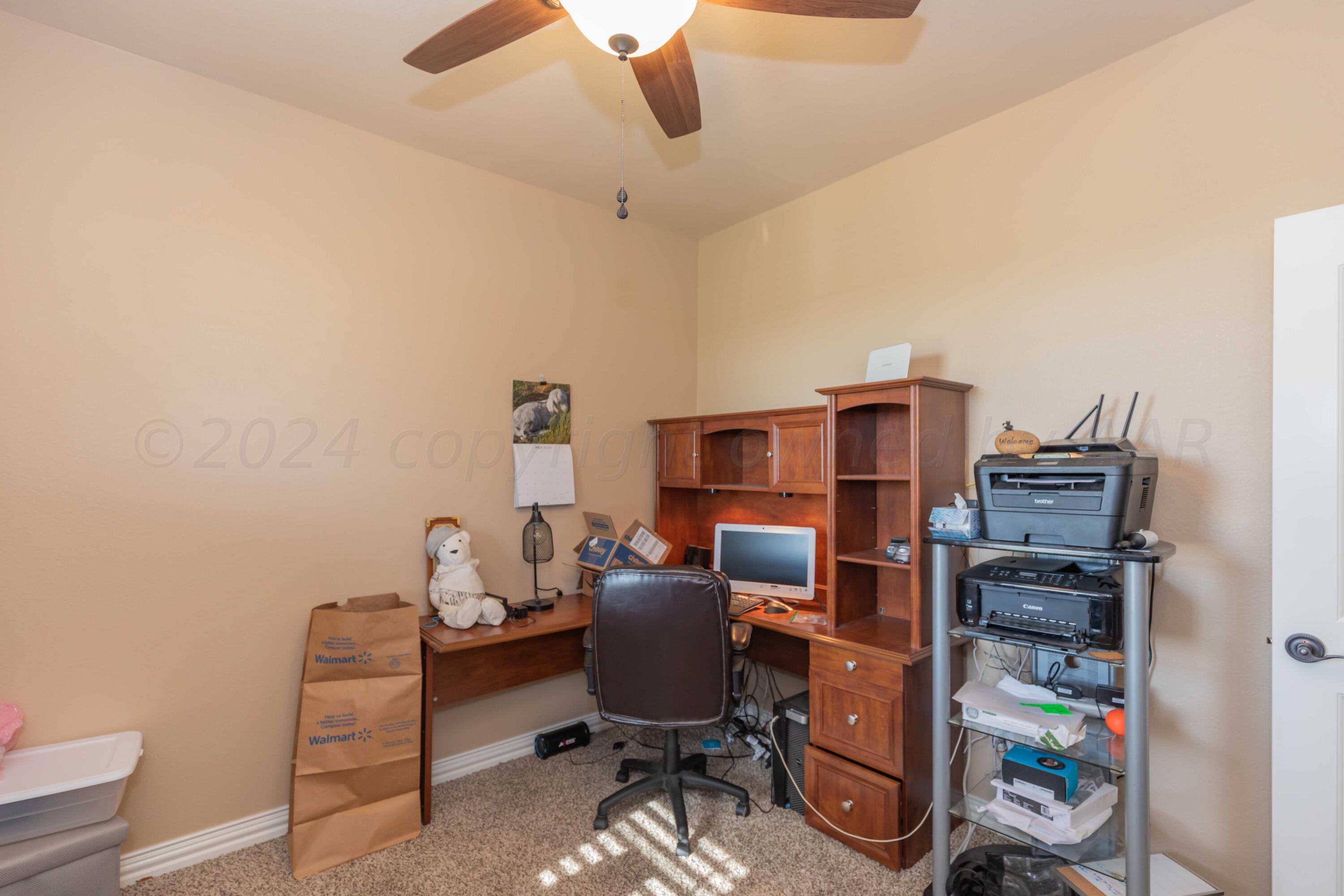 2450 Blue Springs Amarillo, TX 79124 - Photo 28 of 51 a view of a workspace with furniture