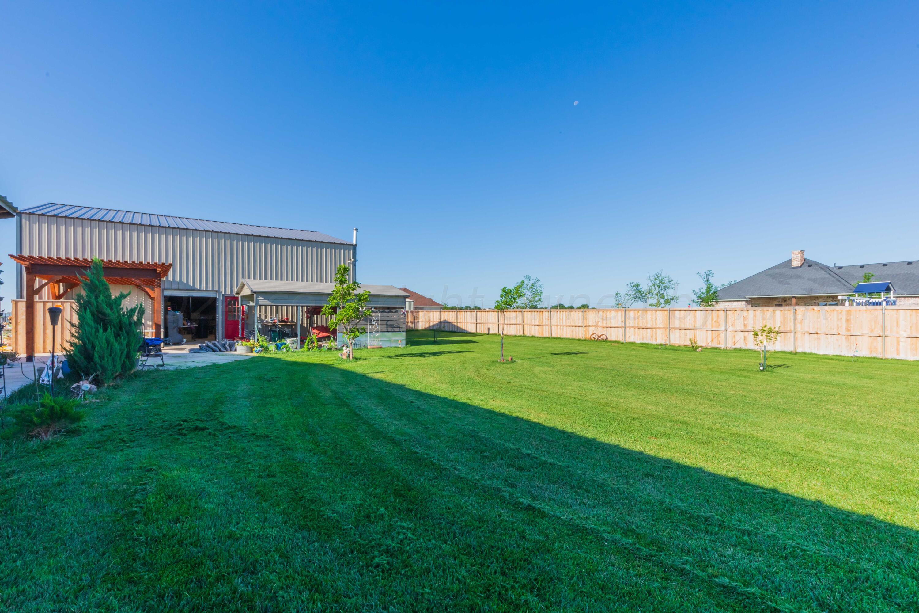 2450 Blue Springs Amarillo, TX 79124 - Photo 38 of 51 a view of yard with swimming pool and green space