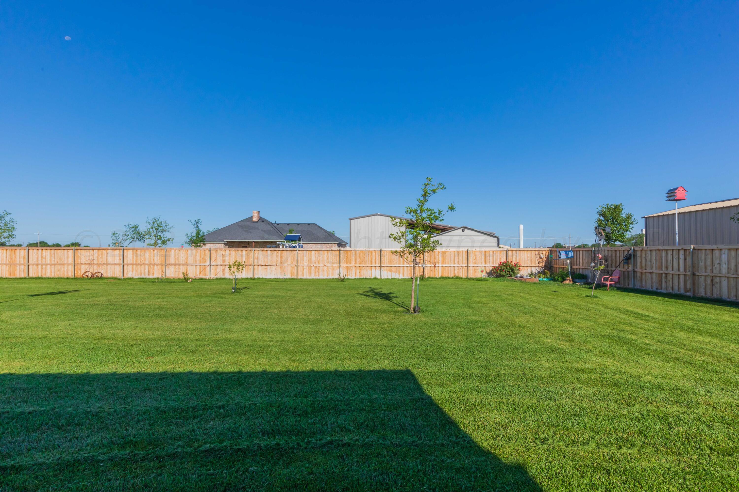 2450 Blue Springs Amarillo, TX 79124 - Photo 39 of 51 a view of green field with house in background