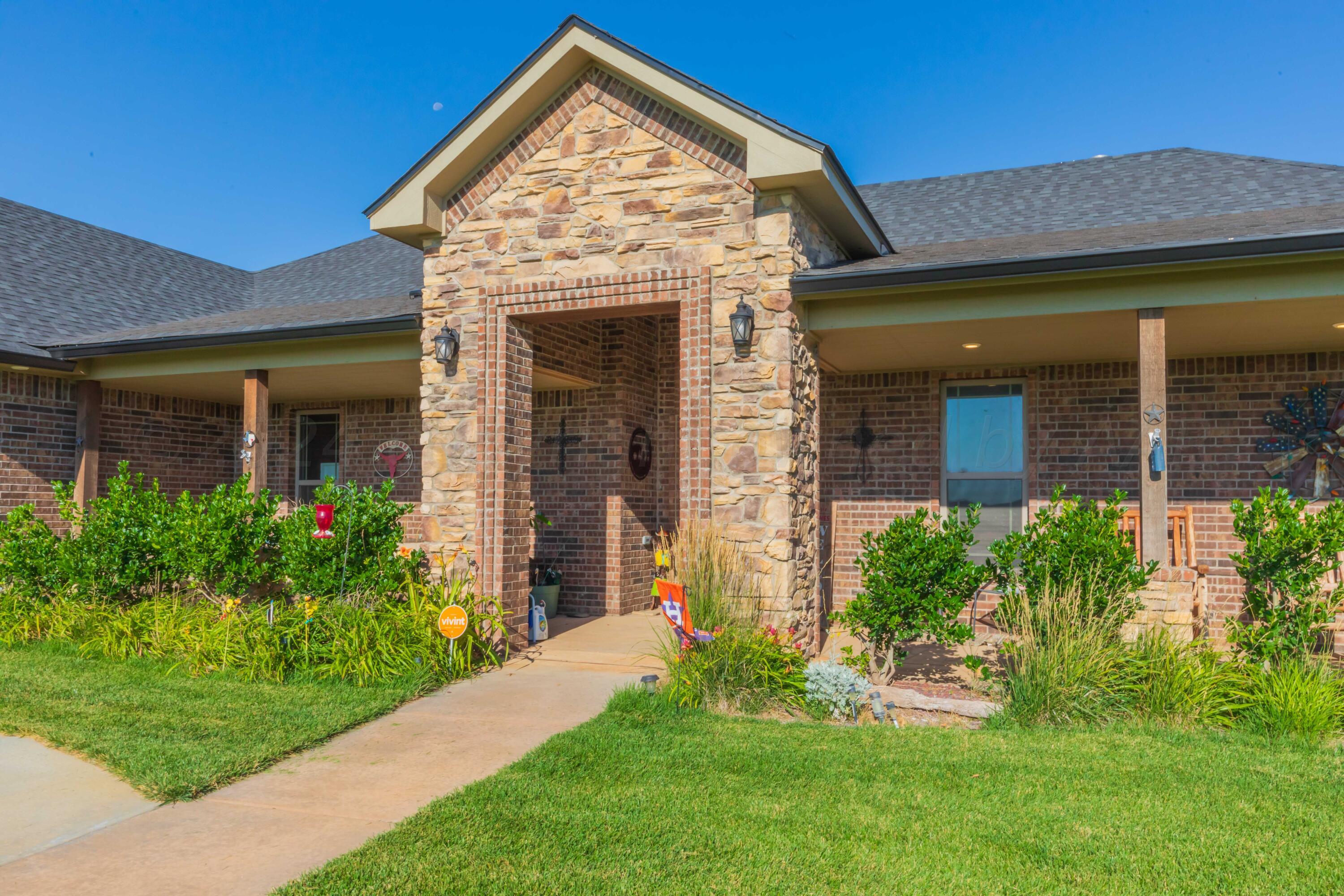 2450 Blue Springs Amarillo, TX 79124 - Photo 4 of 51 front view of a house with a yard