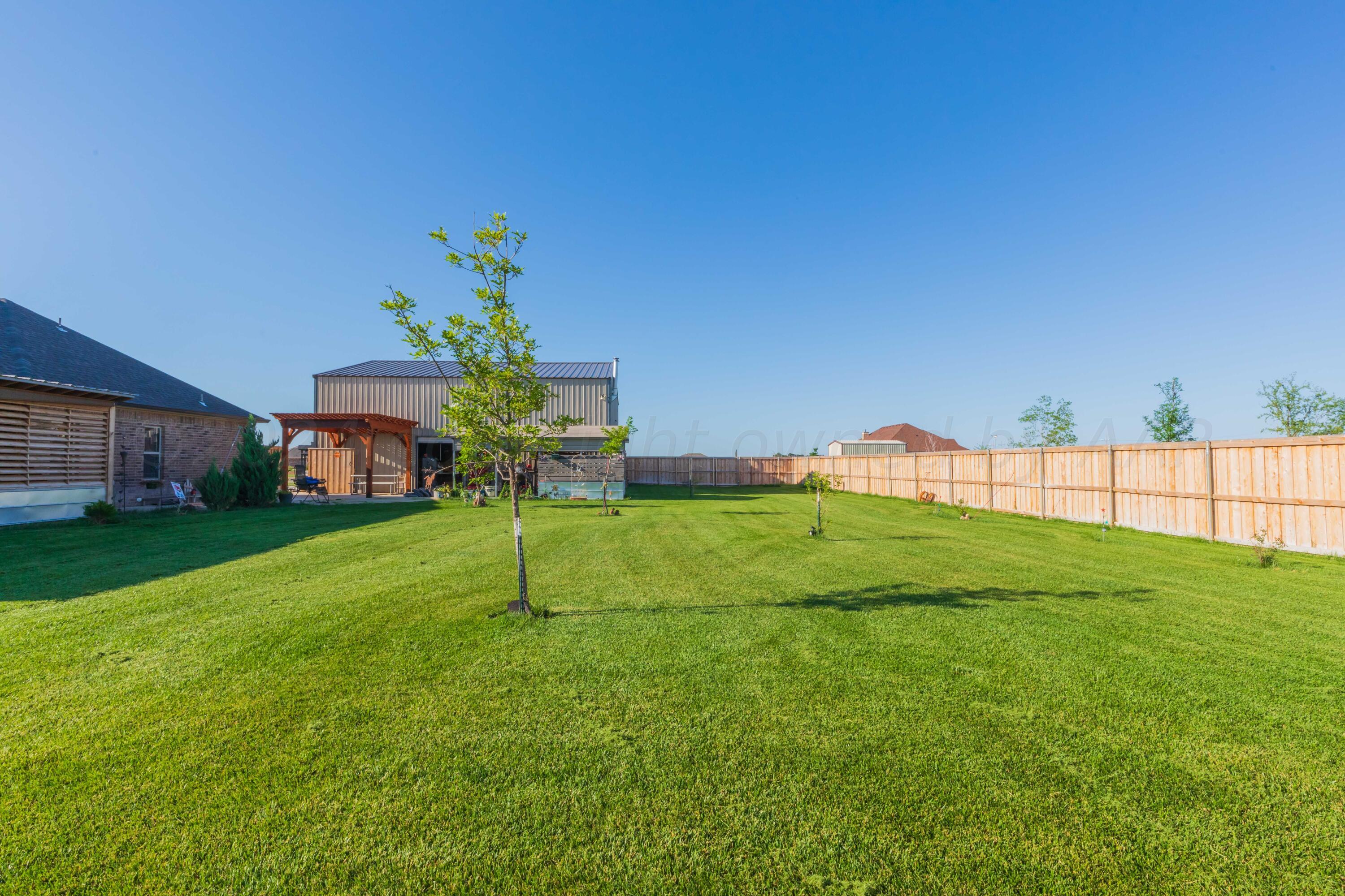 2450 Blue Springs Amarillo, TX 79124 - Photo 41 of 51 a house with a garden in front of it