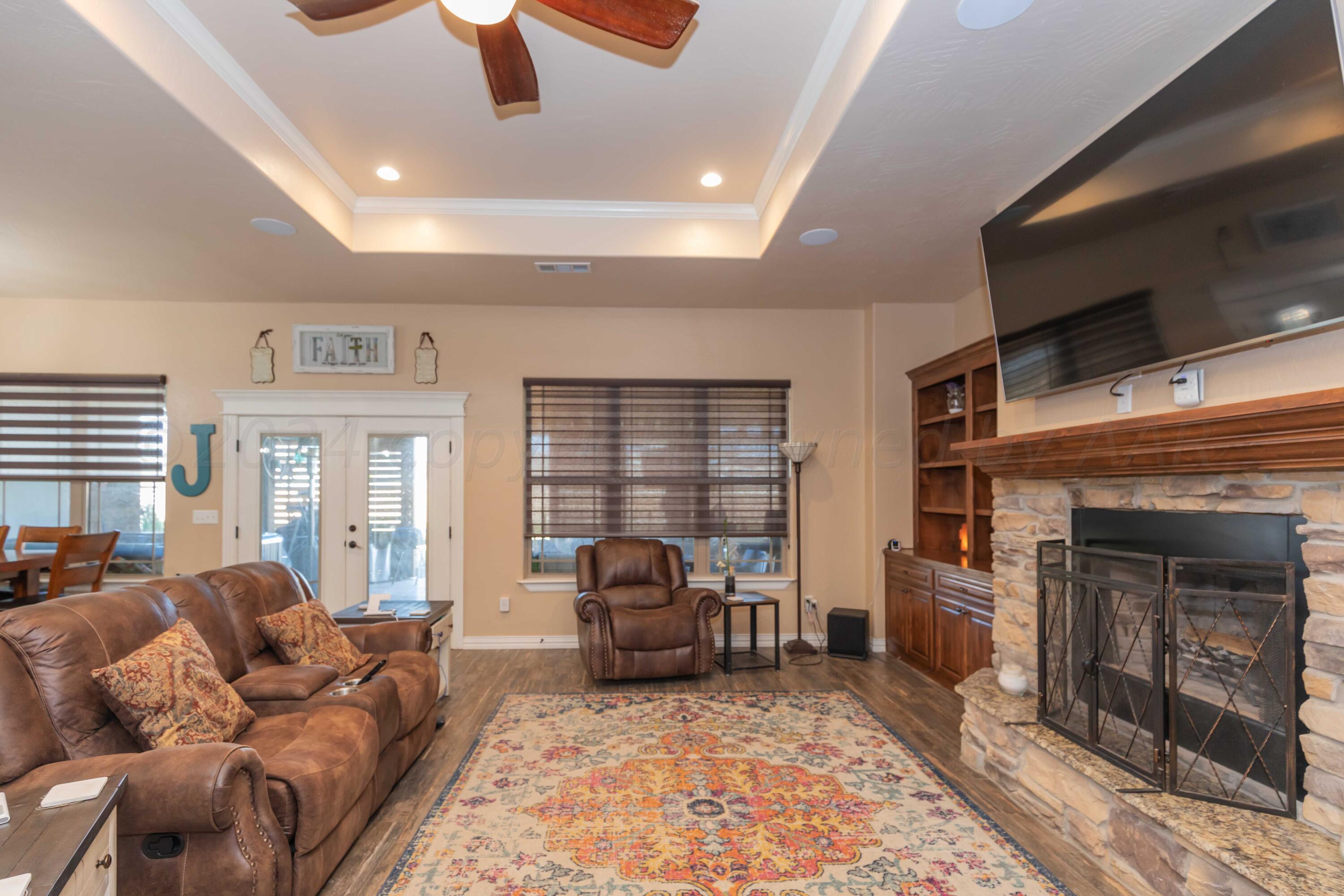 2450 Blue Springs Amarillo, TX 79124 - Photo 8 of 51 a living room with furniture and a fireplace