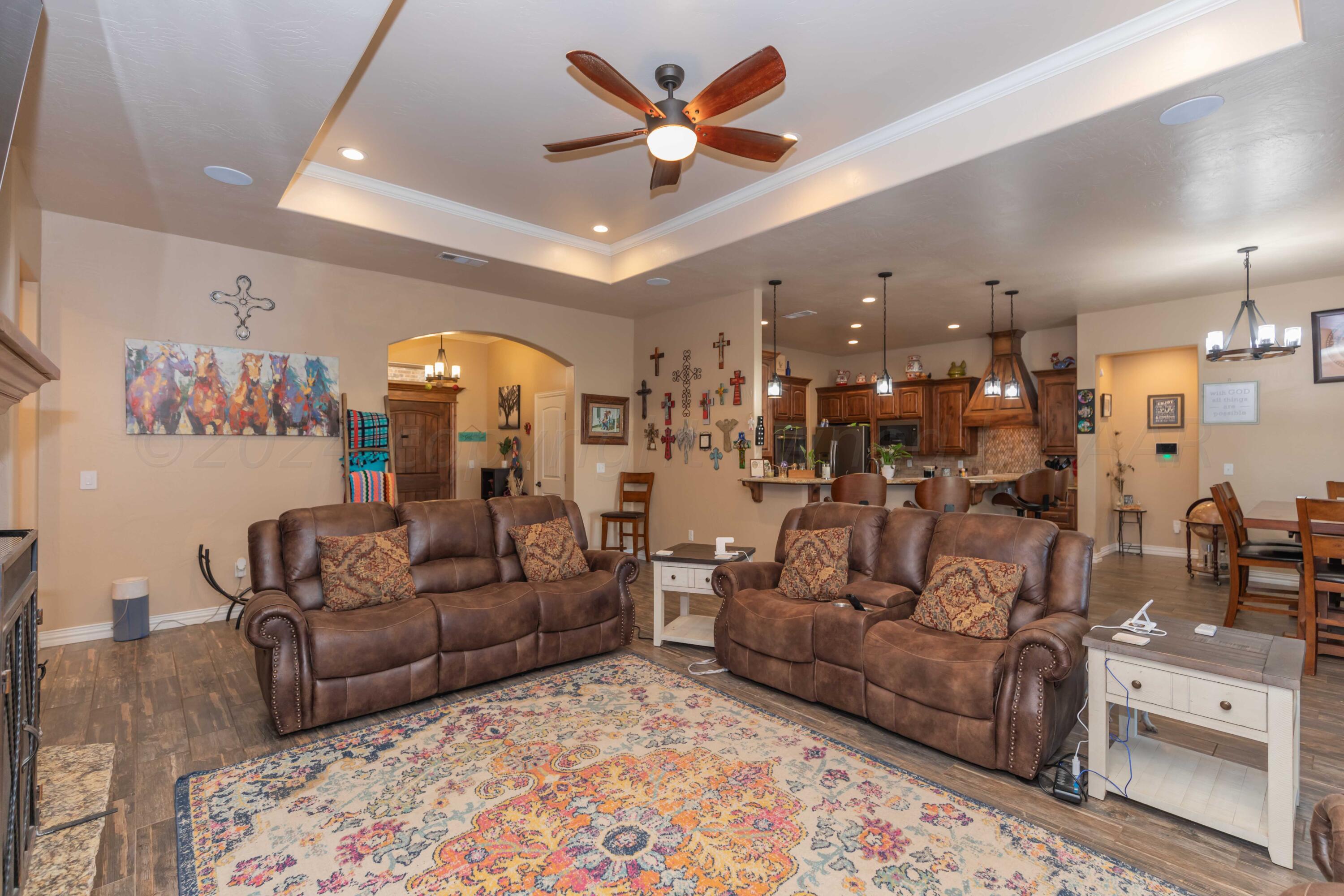 2450 Blue Springs Amarillo, TX 79124 - Photo 9 of 51 a living room with furniture and a chandelier
