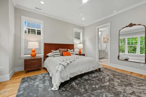 a bedroom with bed and window