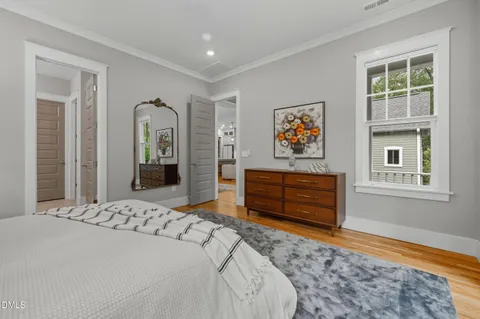 a bedroom with a bed and a dresser