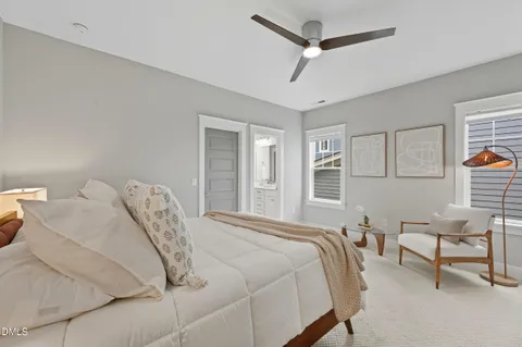 a bedroom with a bed and a chair