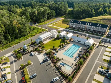 an aerial view of a house with a swimming pool