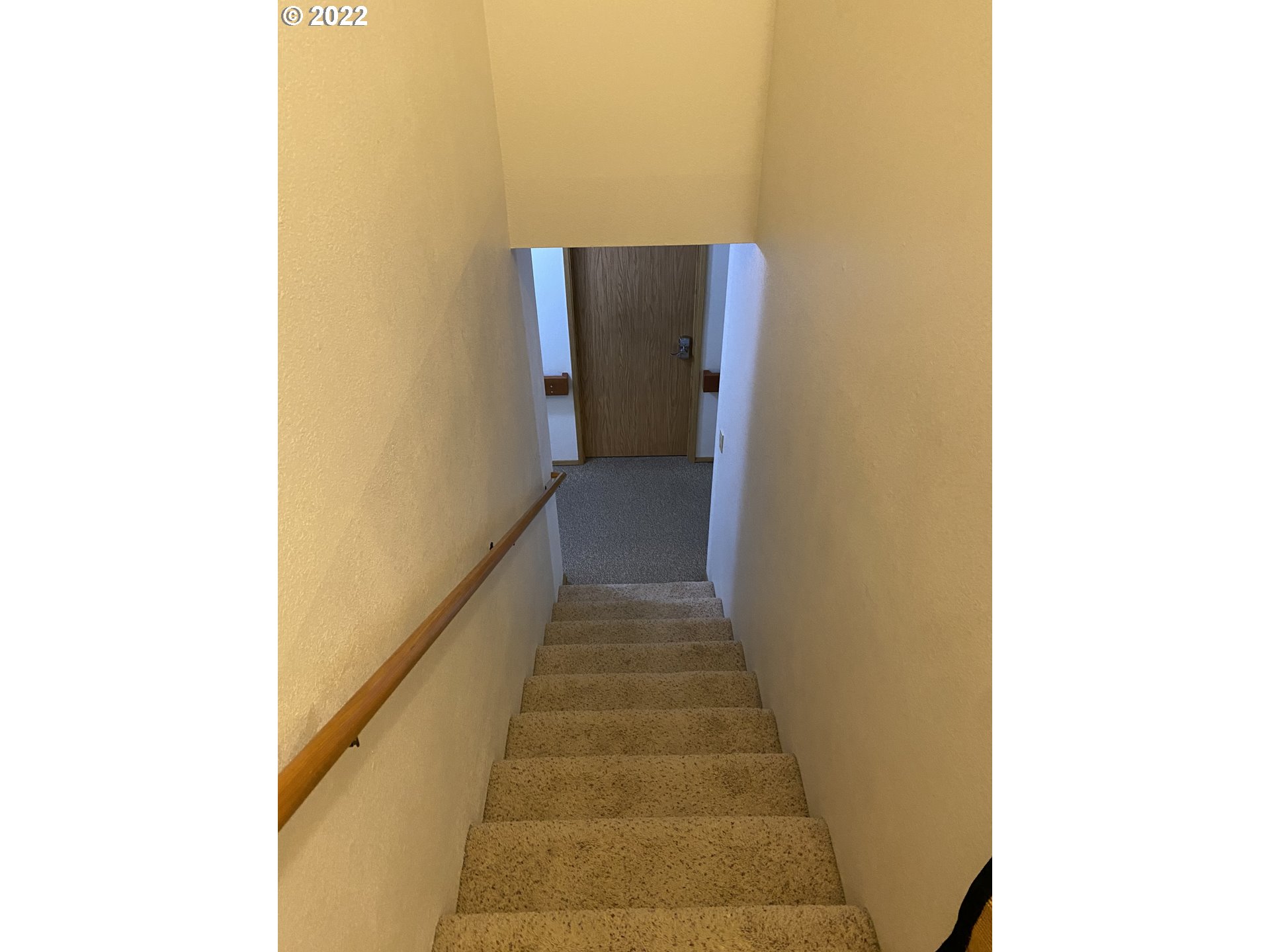 987 Arcadia Drive Eugene, OR 97401 - Photo 16 of 29 a view of a hallway with wooden floor