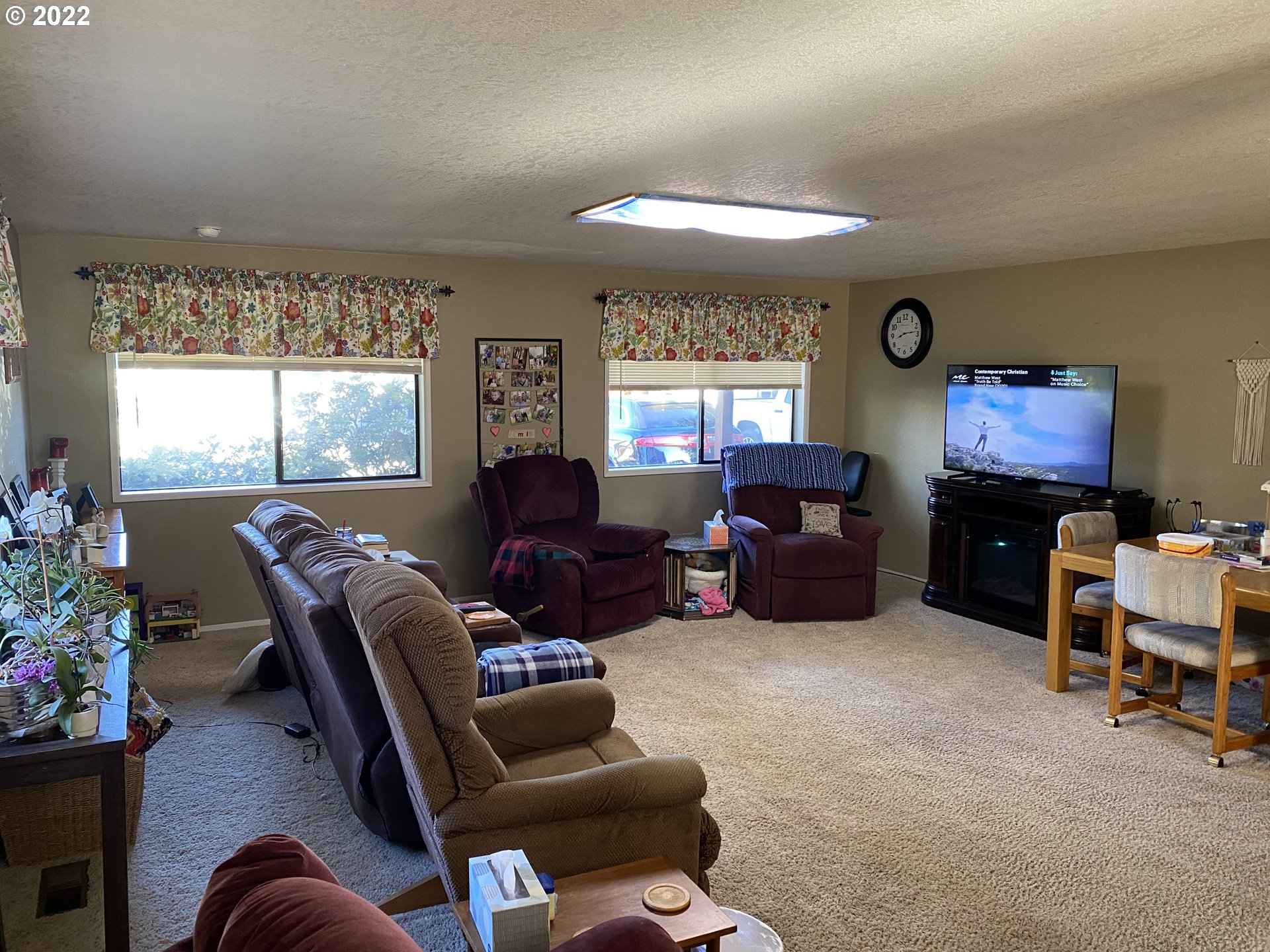 987 Arcadia Drive Eugene, OR 97401 - Photo 5 of 29 a living room with furniture a window and a flat screen tv
