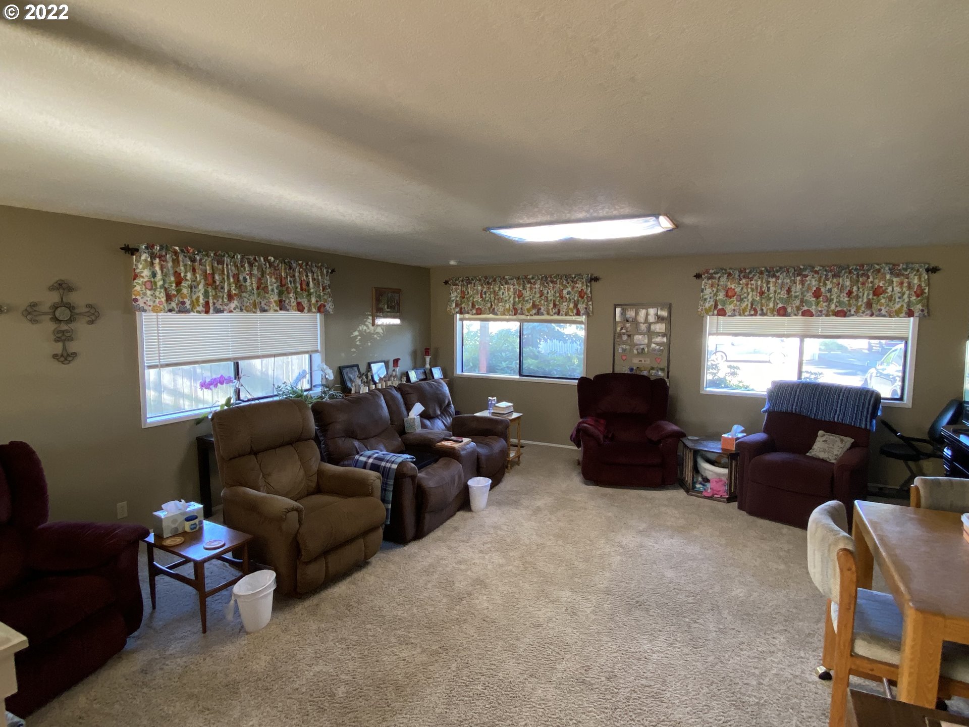 987 Arcadia Drive Eugene, OR 97401 - Photo 6 of 29 a living room with furniture a window and a flat screen tv