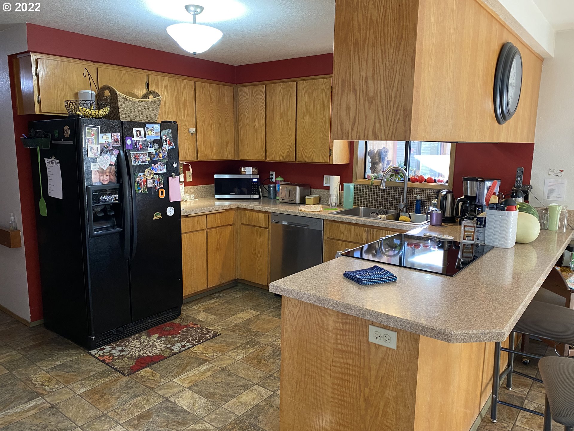 987 Arcadia Drive Eugene, OR 97401 - Photo 8 of 29 a kitchen with a sink a refrigerator and cabinets
