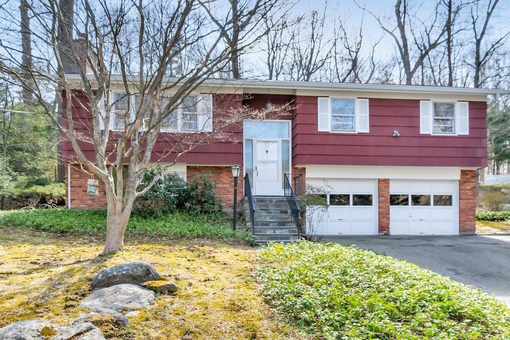a front view of a house with a yard