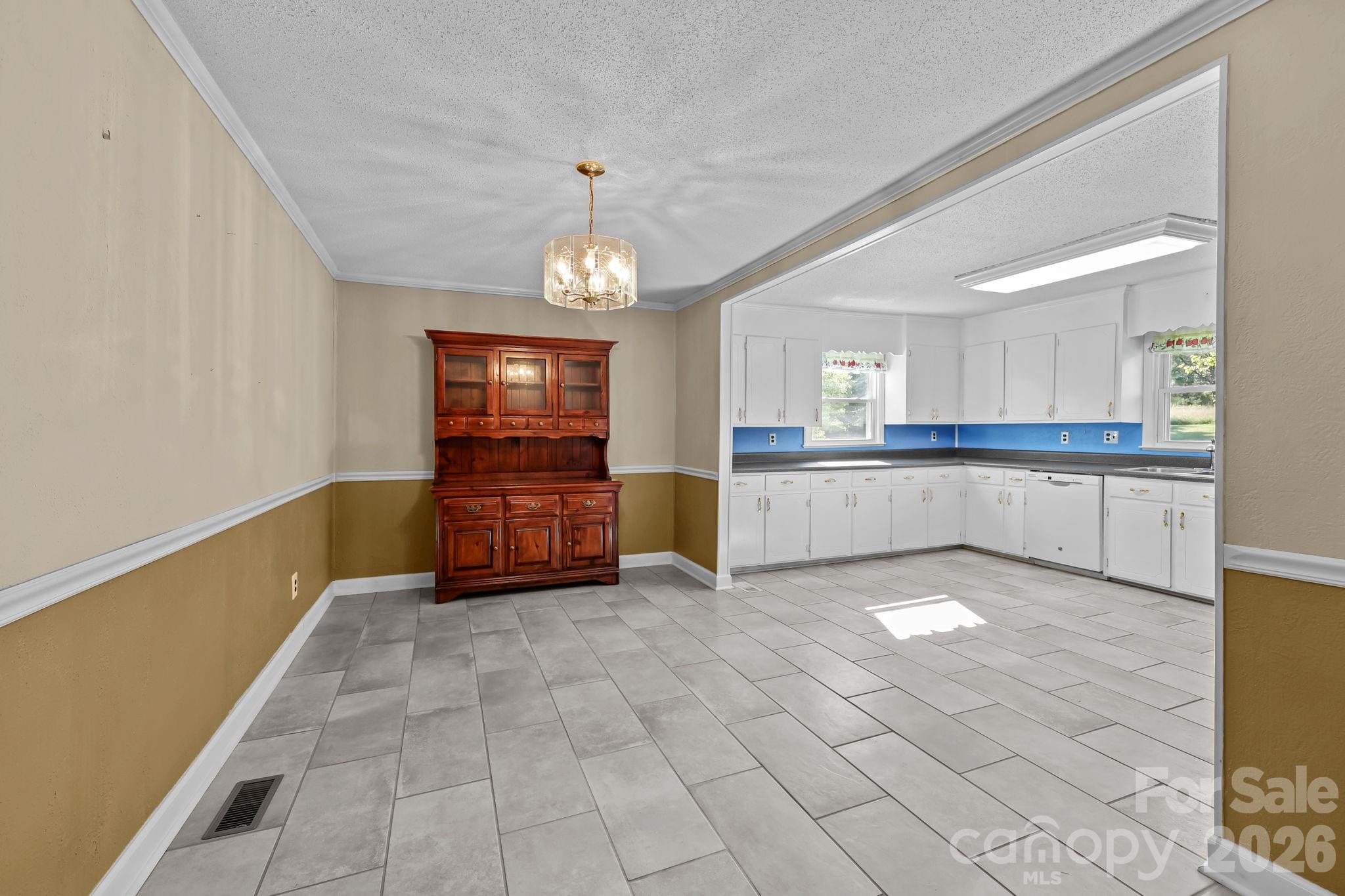 945 Alvin Hough Road Midland, NC 28107 - Photo 14 of 27 a view of a kitchen with a sink and cabinet