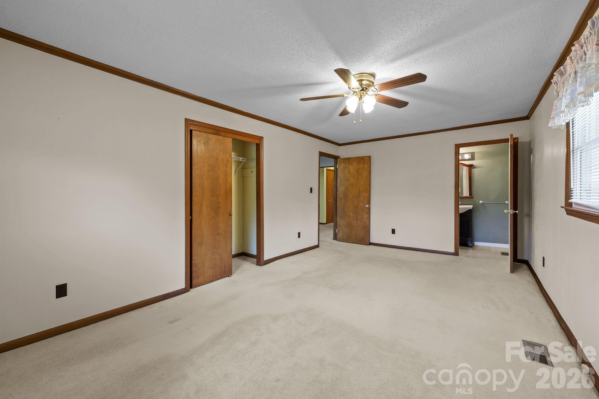 945 Alvin Hough Road Midland, NC 28107 - Photo 15 of 27 a view of a livingroom with a ceiling fan and window
