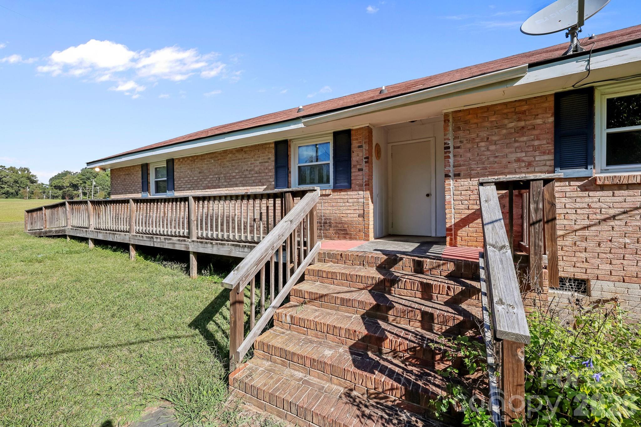 945 Alvin Hough Road Midland, NC 28107 - Photo 5 of 27 a front view of house with deck and outdoor seating