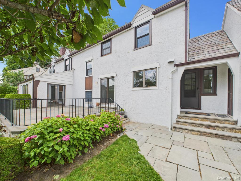 75 Lord Kitchener Road New Rochelle, NY 10804 - Photo 14 of 47 a front view of a house with a garden