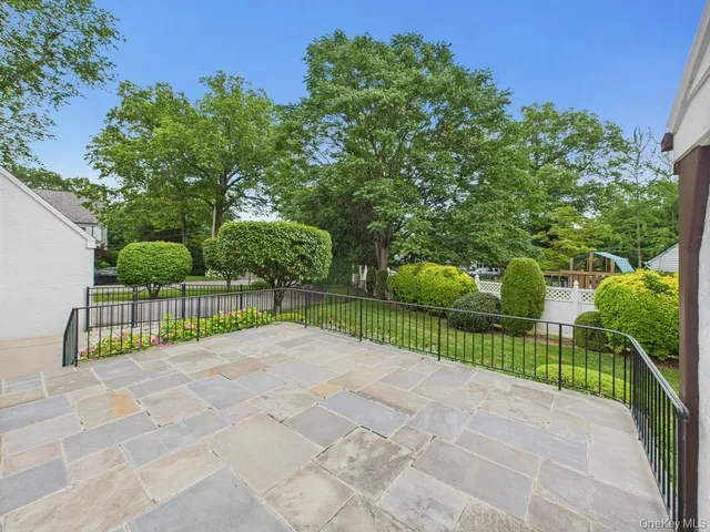 a view of a pathway with a small yard