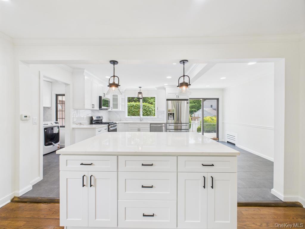 75 Lord Kitchener Road New Rochelle, NY 10804 - Photo 2 of 47 a bathroom with a sink and a mirror
