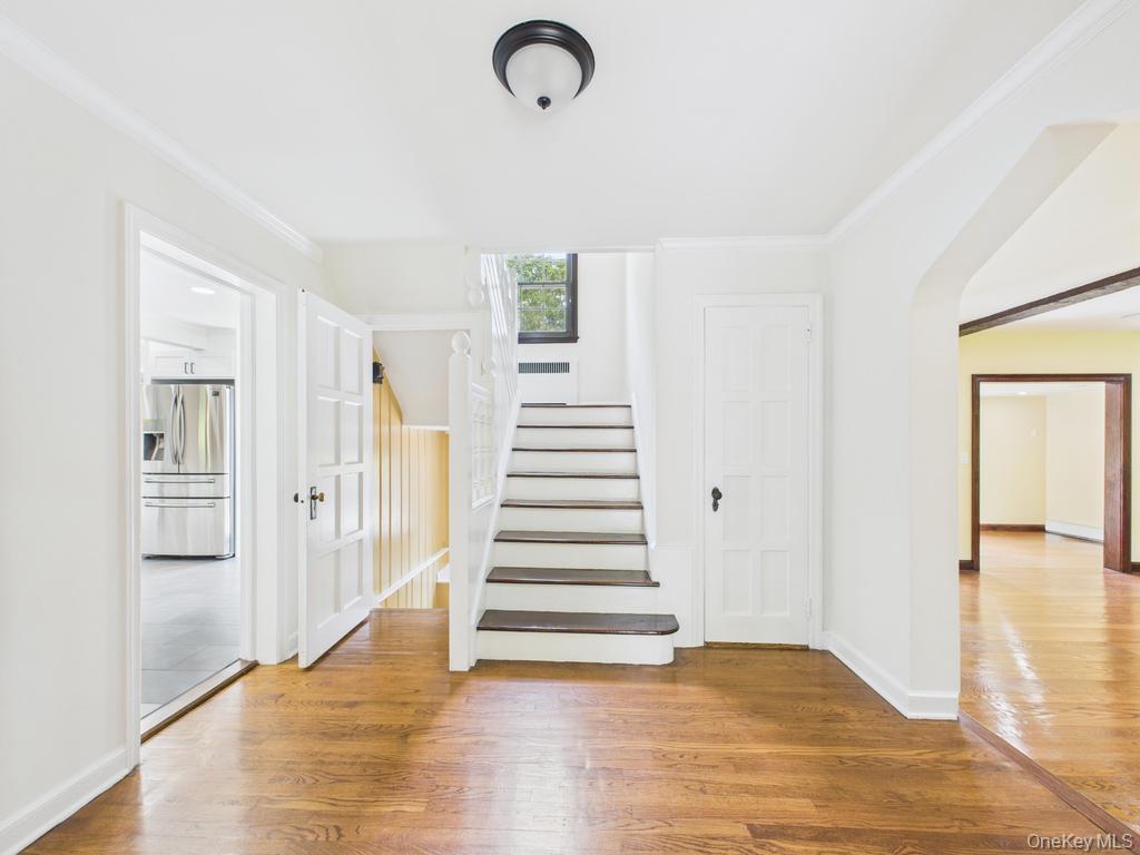 75 Lord Kitchener Road New Rochelle, NY 10804 - Photo 21 of 47 a view of a room with wooden floor and stairs