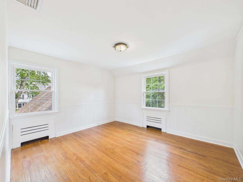 75 Lord Kitchener Road New Rochelle, NY 10804 - Photo 29 of 47 a view of room with window and hardwood floor