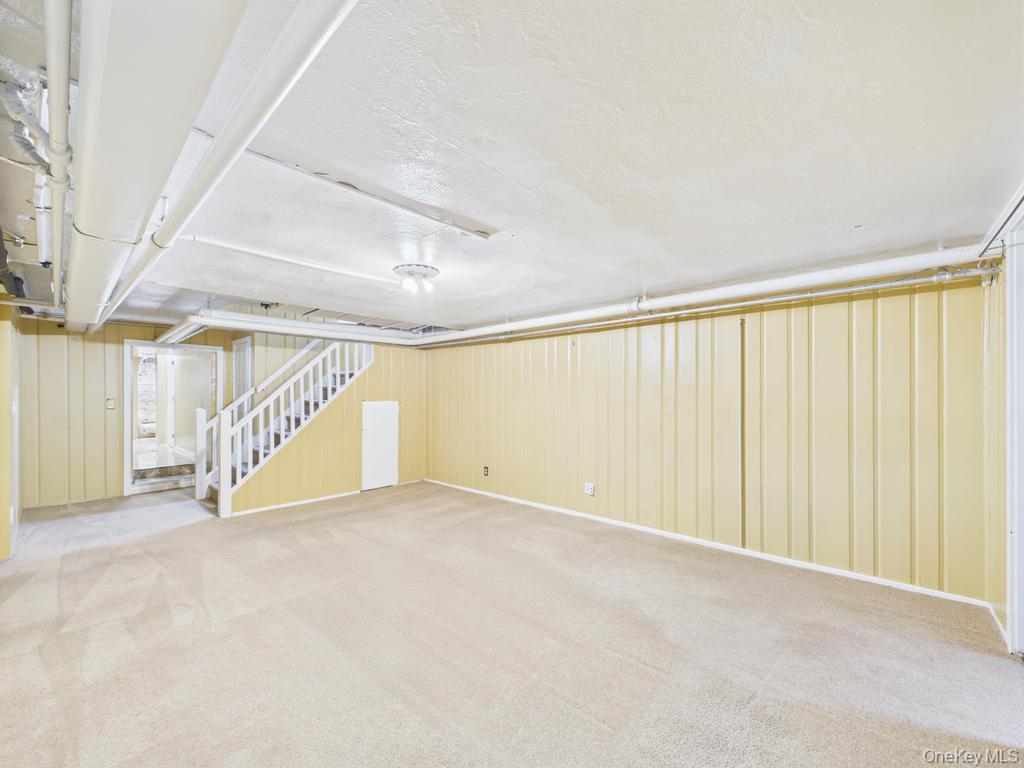 75 Lord Kitchener Road New Rochelle, NY 10804 - Photo 36 of 47 a view of an empty room with stairs