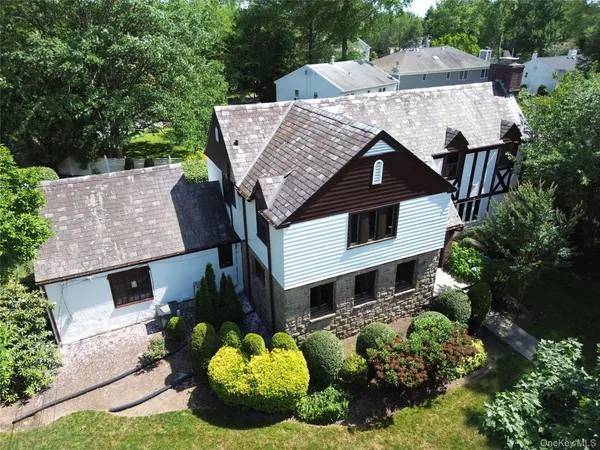 an aerial view of a house with a garden