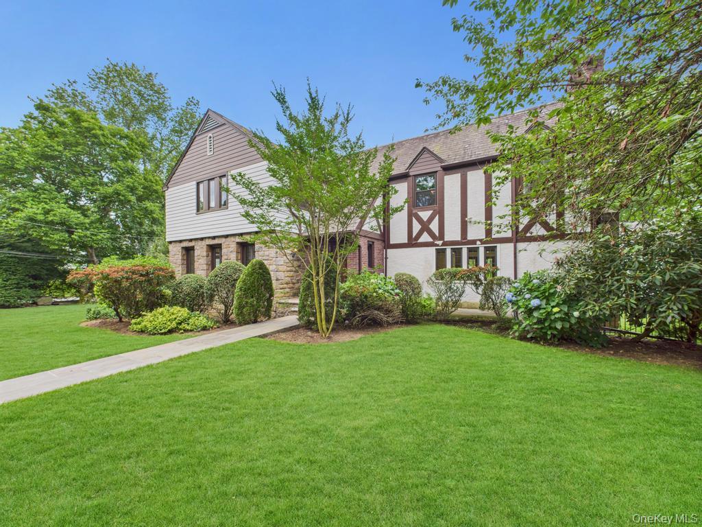75 Lord Kitchener Road New Rochelle, NY 10804 - Photo 8 of 47 a front view of a house with garden