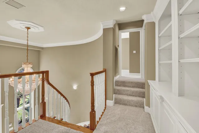 a view of a hallway with staircase