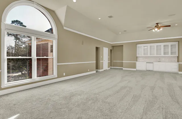 a view of empty room with windows