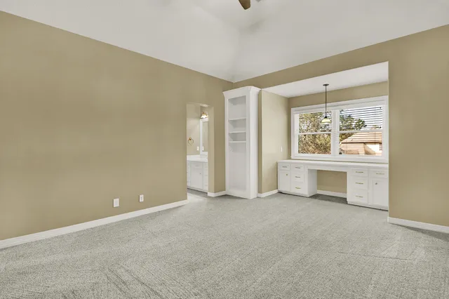 a view of an empty room and fire place