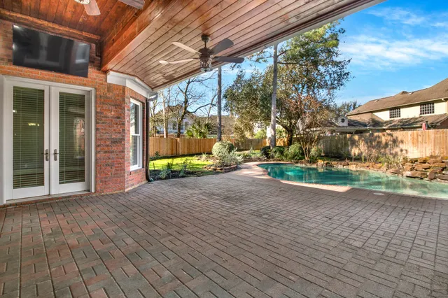 a pathway of a house with a yard