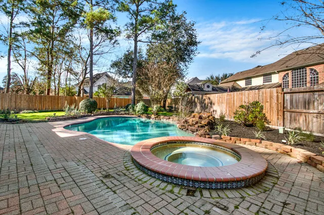 a front view of a house with a yard table and chairs
