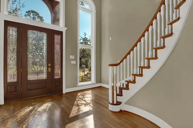 a view of an entryway with wooden floor