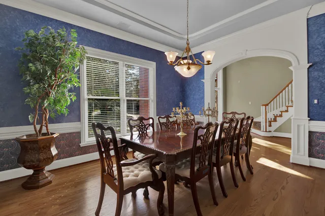 a view of a dining room with furniture window and wooden floor