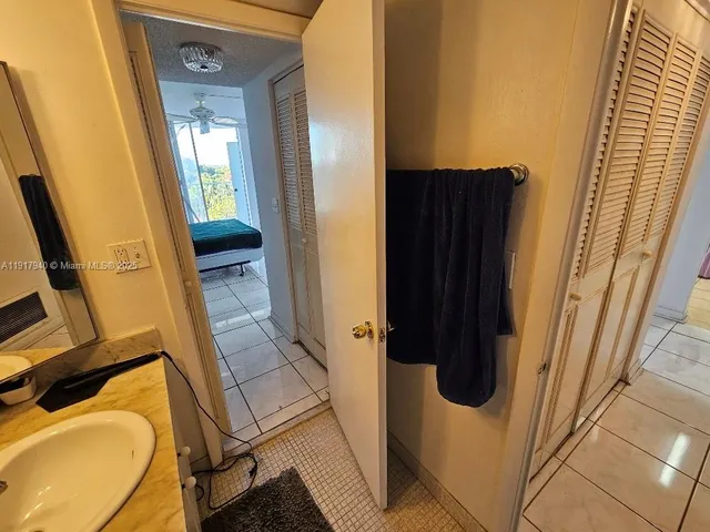 a bathroom with a tub and a sink
