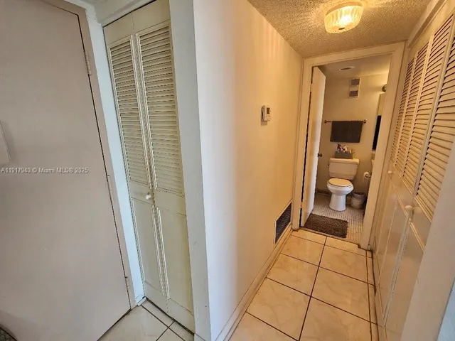 a view of bathroom with a sink and a mirror