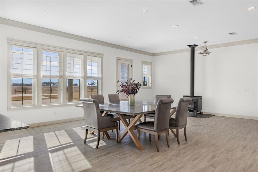 2263 County Road 33040, Unit 4 Brookston, TX 75421 - Photo 22 of 38 a view of a dining room with furniture window and wooden floor