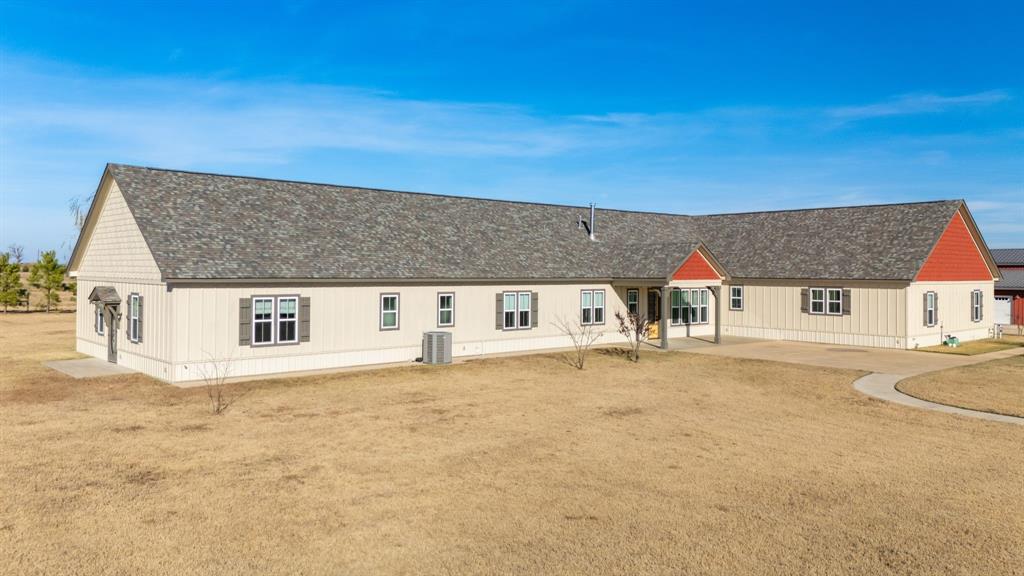 2263 County Road 33040, Unit 4 Brookston, TX 75421 - Photo 6 of 38 a view of a big house with a big yard