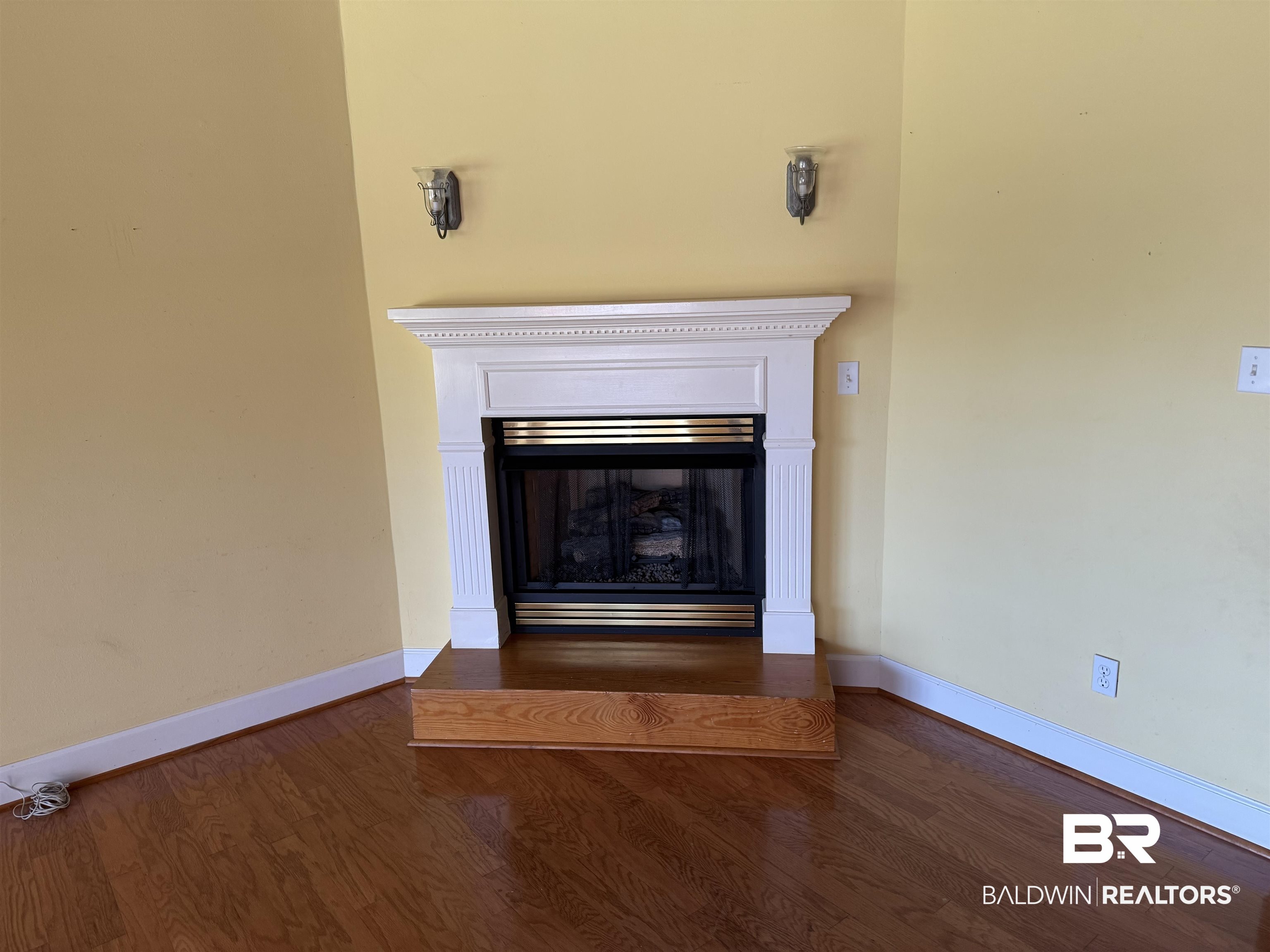 415 Juniper Creek Road Brewton, AL 36426 - Photo 14 of 35 Detailed view of a fireplace and wood finished floors
