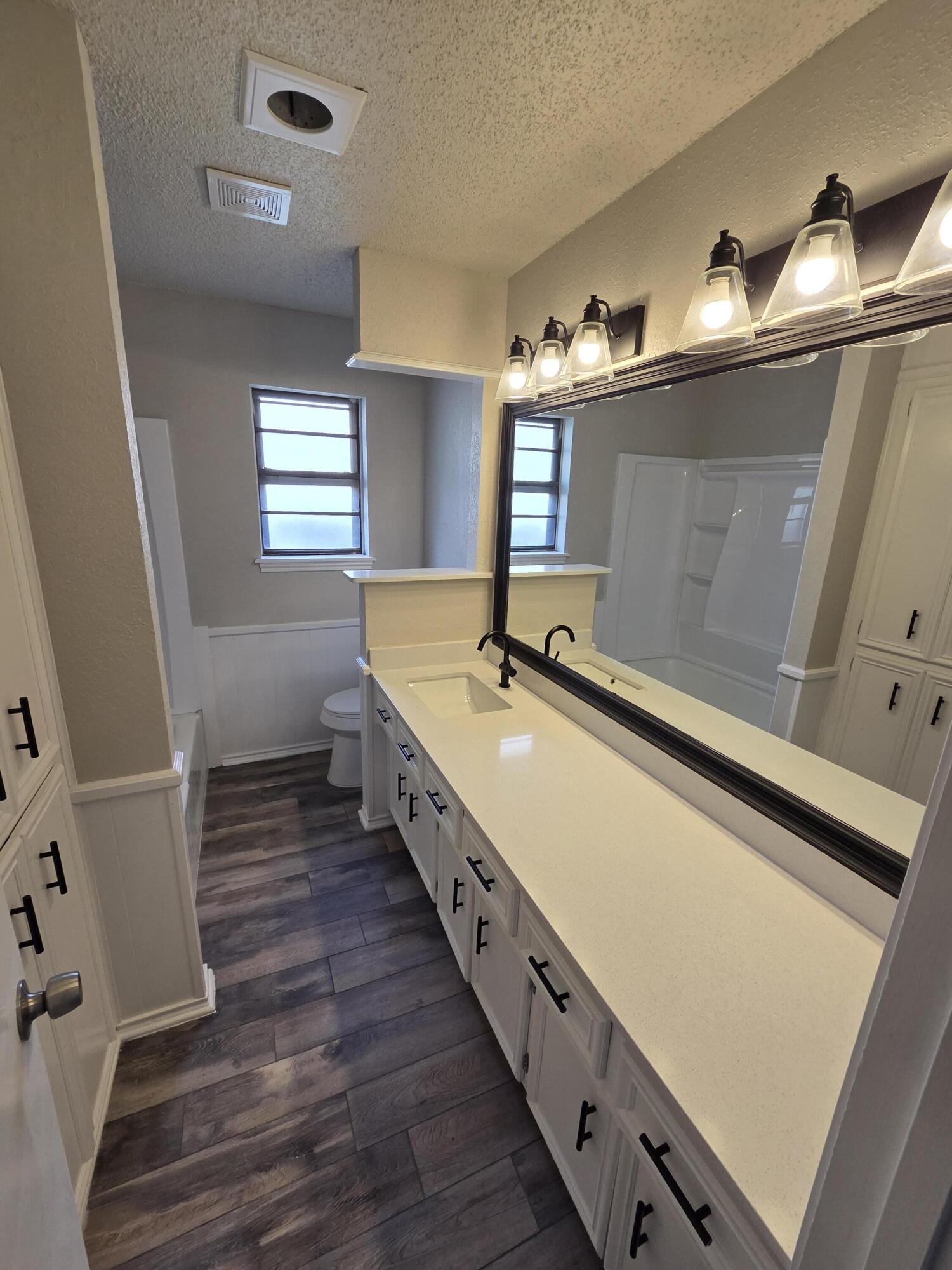 5224 73rd Street Lubbock, TX 79424 - Photo 7 of 18 Hall bathroom