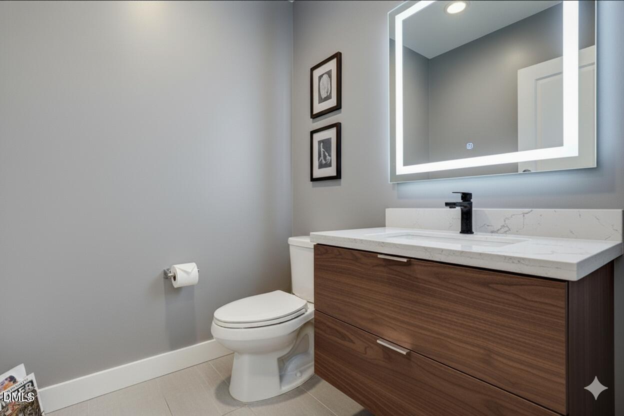 1605 Hunting Ridge Road Raleigh, NC 27615 - Photo 23 of 55 a bathroom with a sink a toilet and mirror
