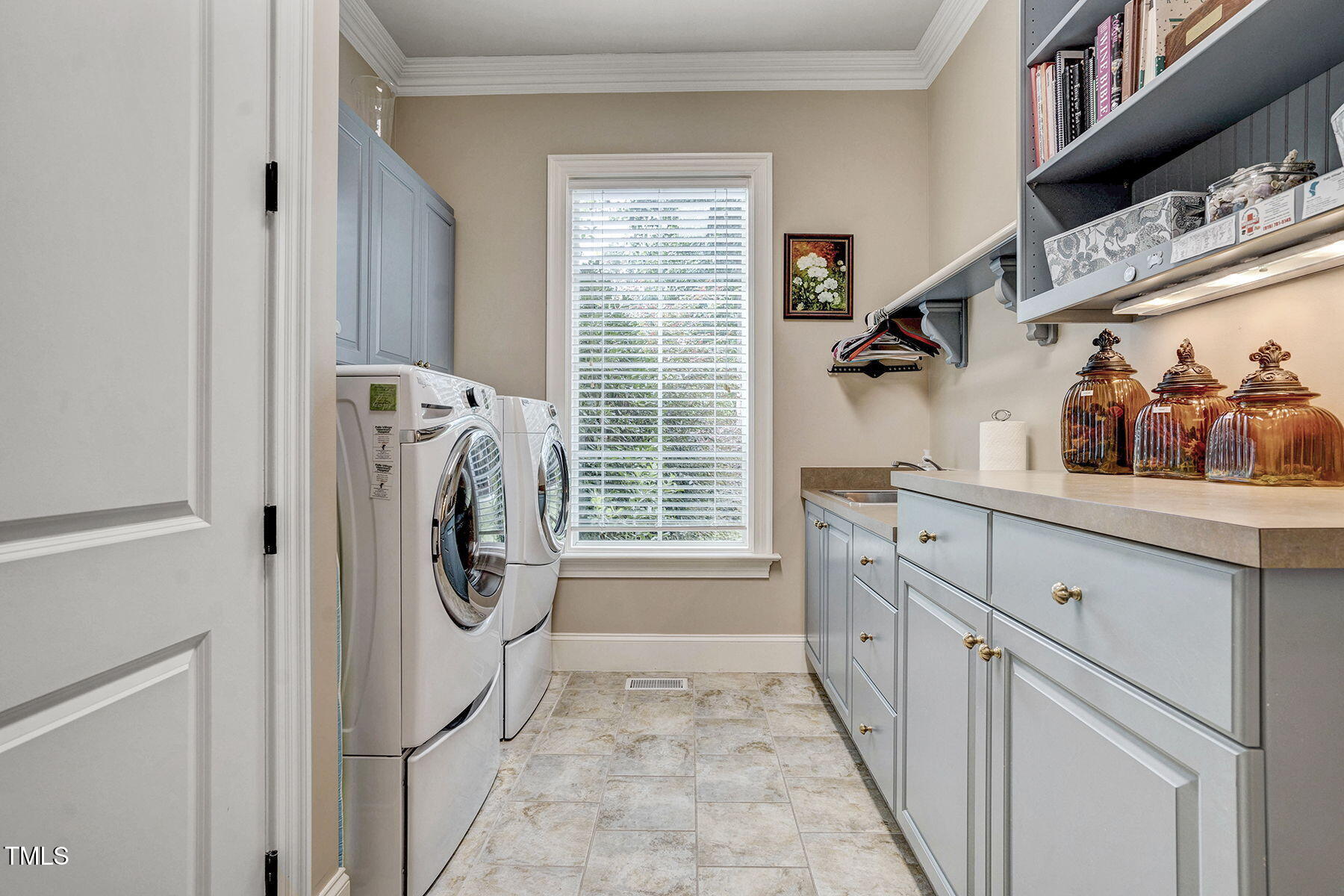 1605 Hunting Ridge Road Raleigh, NC 27615 - Photo 24 of 55 a utility room with cabinets