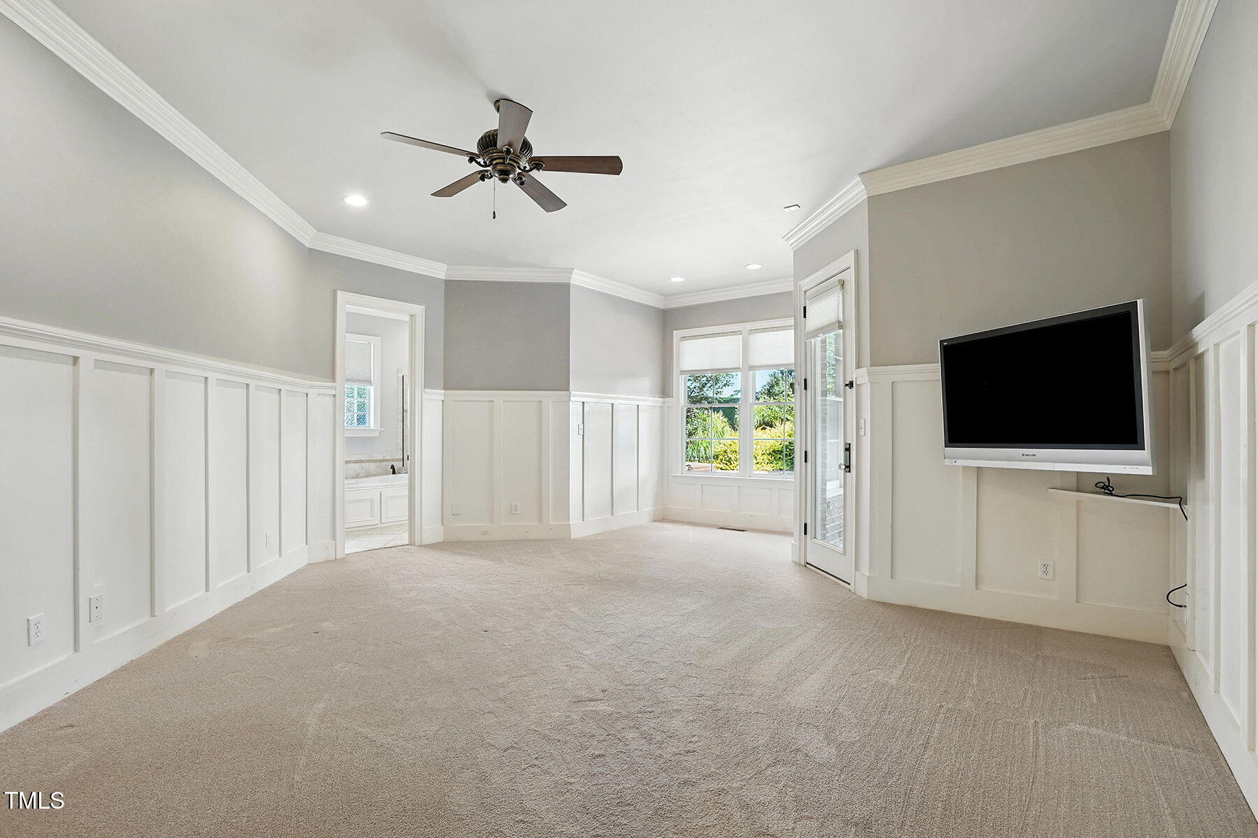 1605 Hunting Ridge Road Raleigh, NC 27615 - Photo 25 of 55 a view of a livingroom with an empty space and a flat screen tv