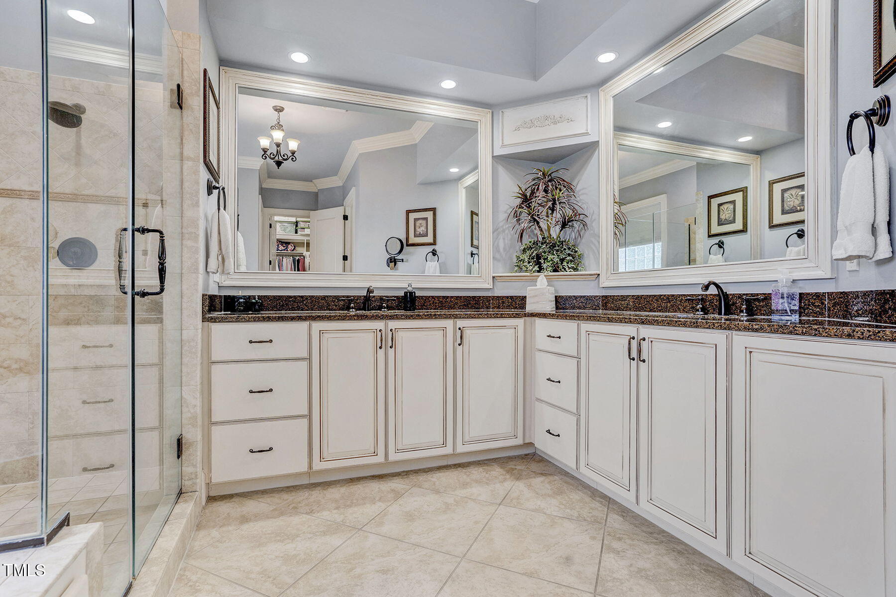 1605 Hunting Ridge Road Raleigh, NC 27615 - Photo 27 of 55 a spacious bathroom with a granite countertop sink mirror and