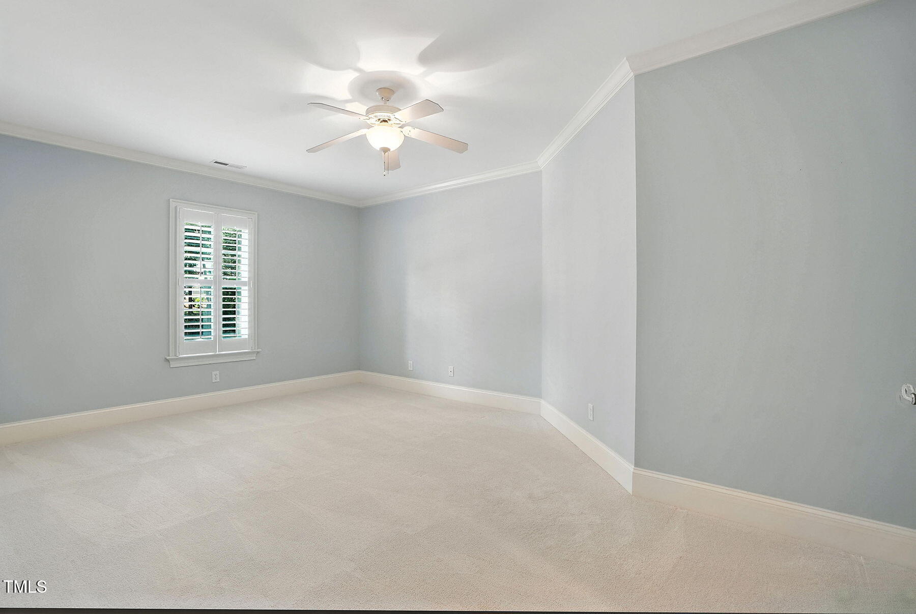 1605 Hunting Ridge Road Raleigh, NC 27615 - Photo 33 of 55 en empty room with windows and chandelier fan